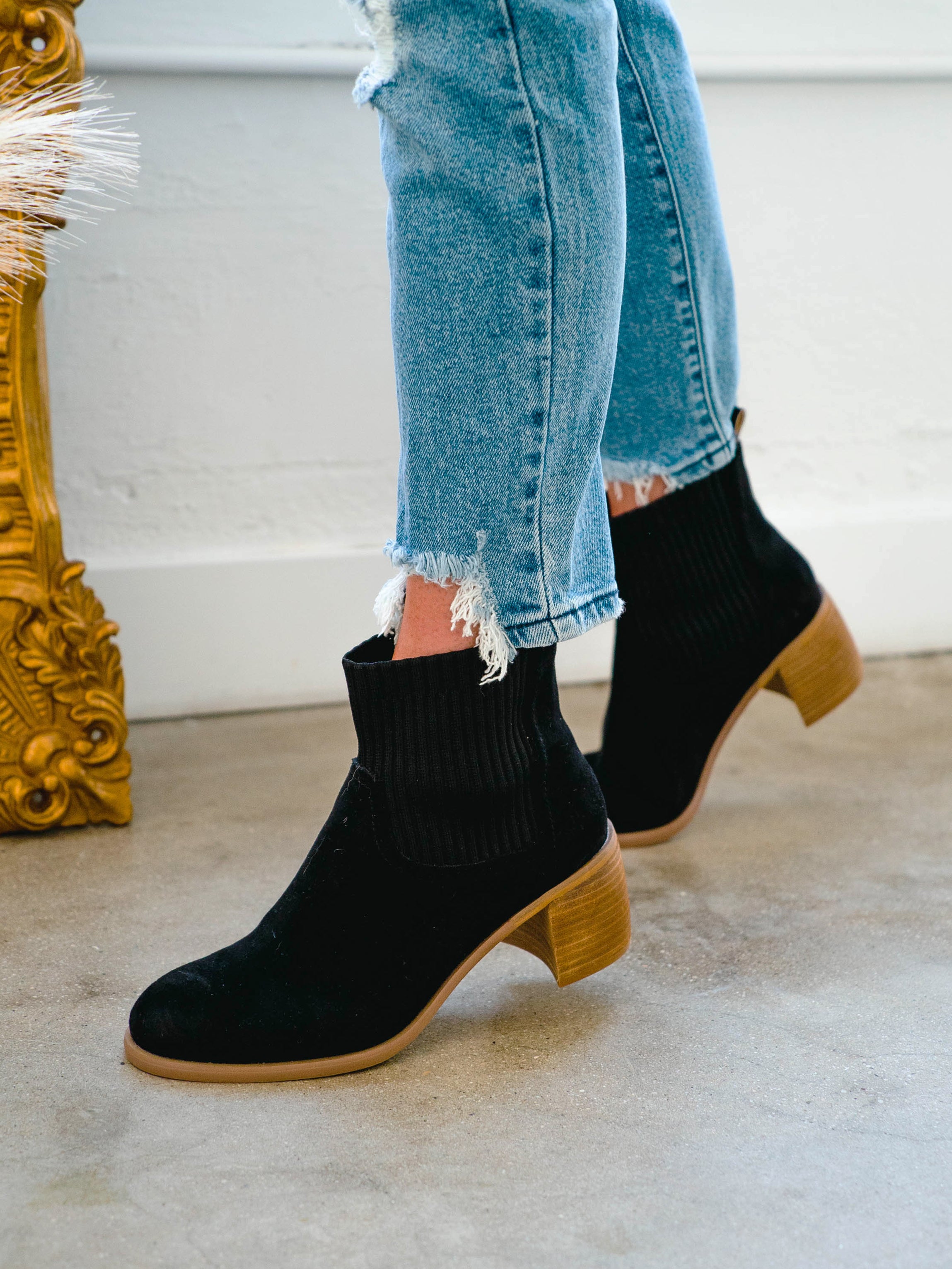 Black booties with top gold detail